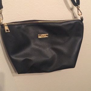 BCBGeneration Crossbody bag. Black with gold trim